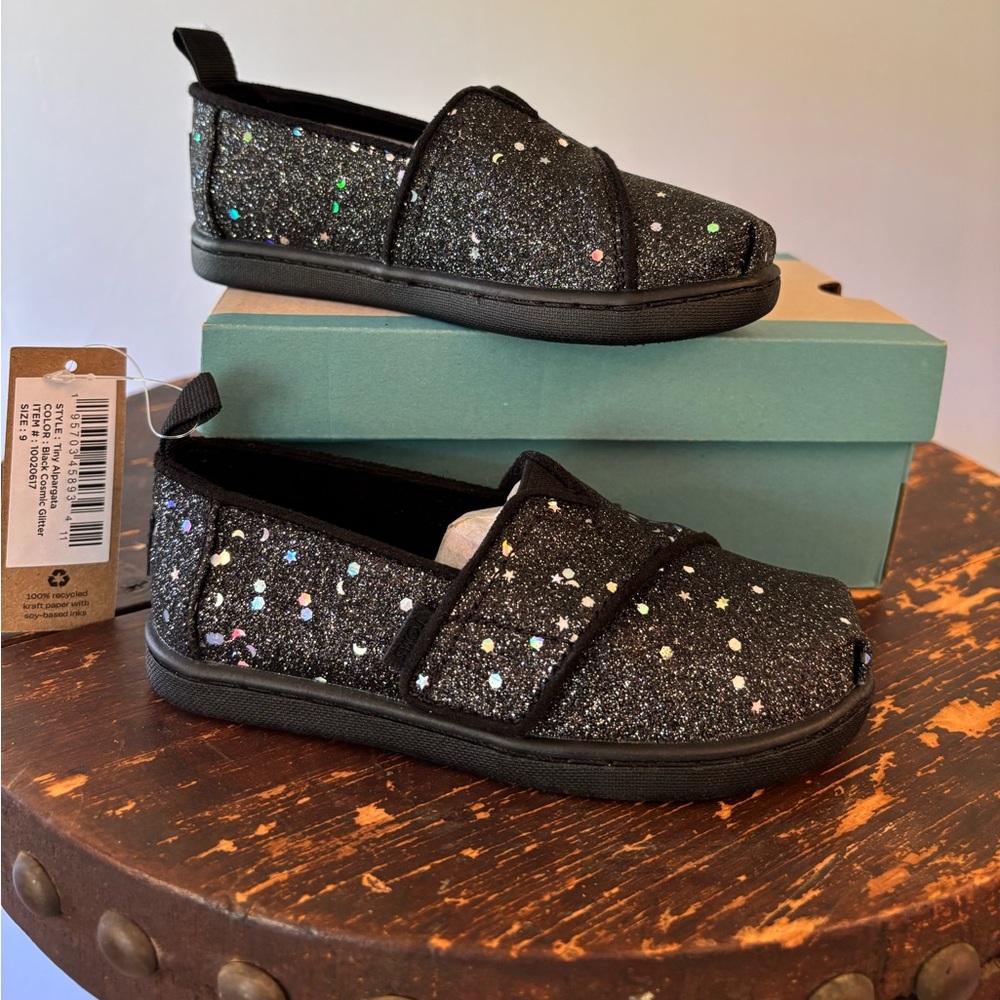 NEW and never worn TOMS children’s Black Cosmic Glitter. Velcro closure Size 9.